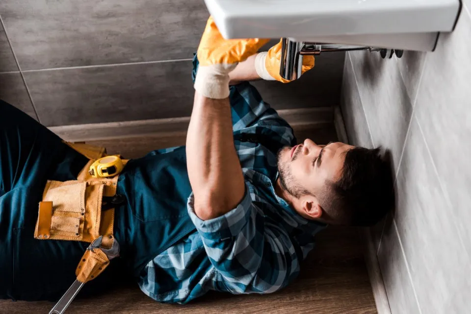 Spangler Plumbing technician replacing polybutylene pipes in a Delaware home